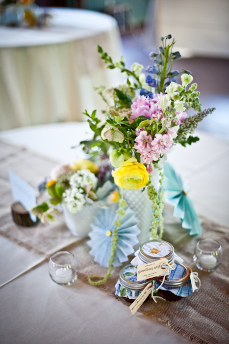 The Bride collected blue mason jars and milk glass from friends and antique